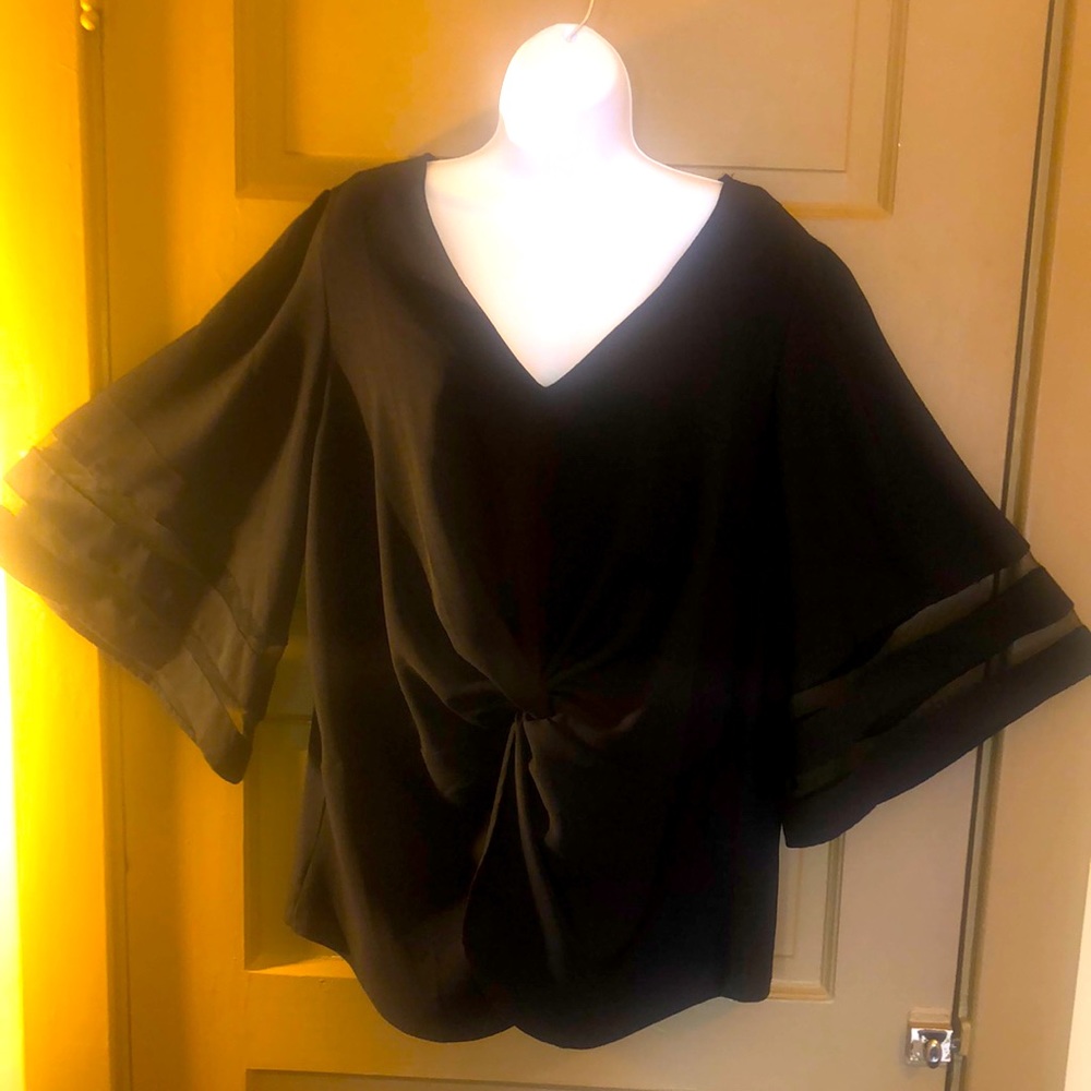 Black top 100%polyester. Very light material